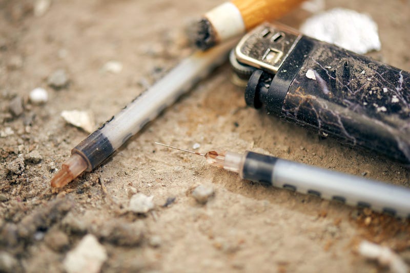 Used syringe on the ground 