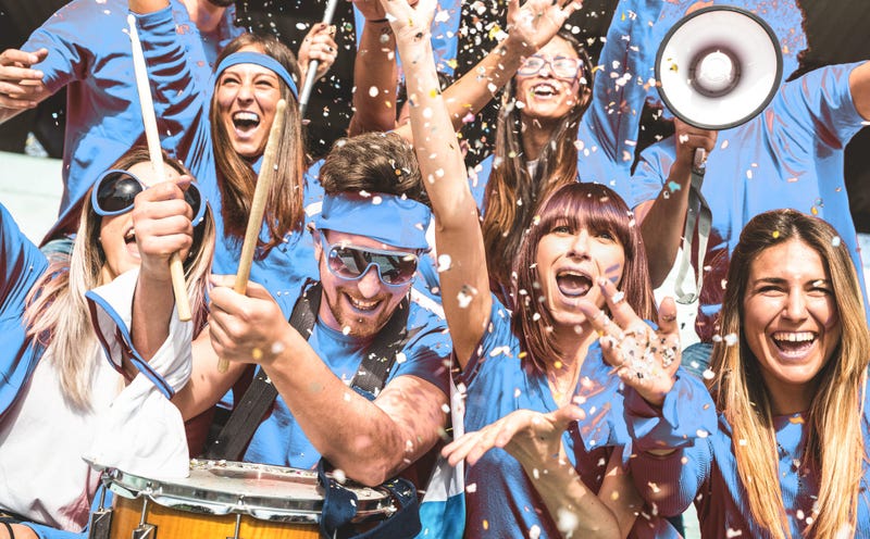 Friends people group on blue t shirts having excited fun on sport world championship final