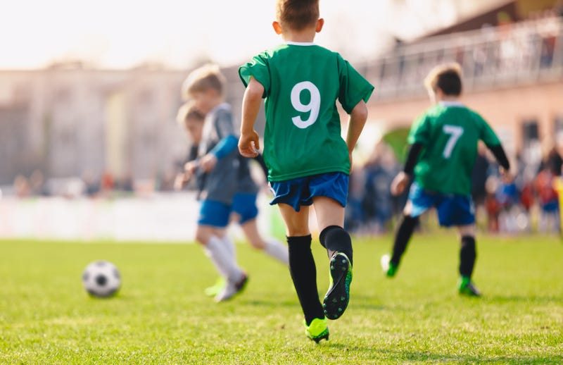 A group of boys playing soccer