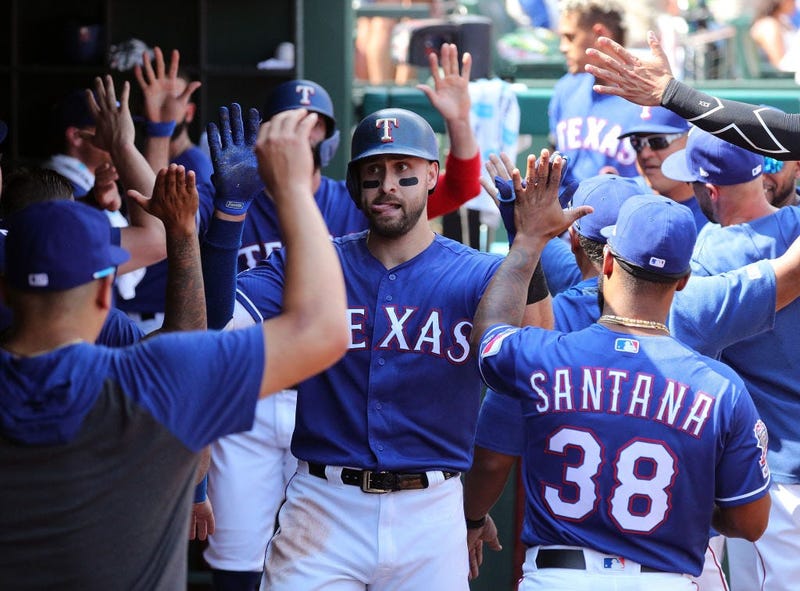 oey Gallo #13 of the Texas Rangers is greeted in the dugout after a two-run home run against the Kansas City Royals in the fourth inning at Globe Life Park in Arlington on June 01, 2019.