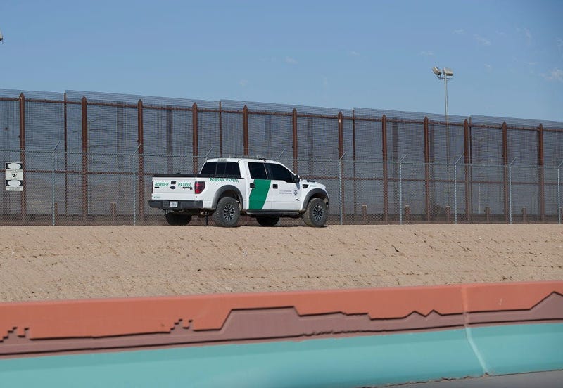U.S. Border Patrol vehicle is seen as it drives along the border fence separating the United States from Mexico in El Paso, Texas.