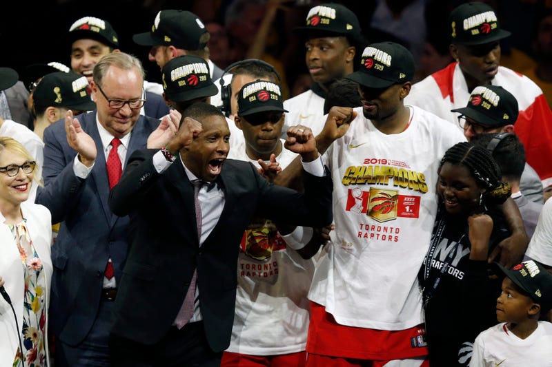 Toronto Raptors President Masai Ujiri celebrates with players after the team defeated the Golden State Warriors to win the NBA Finals on June 13, 2019.