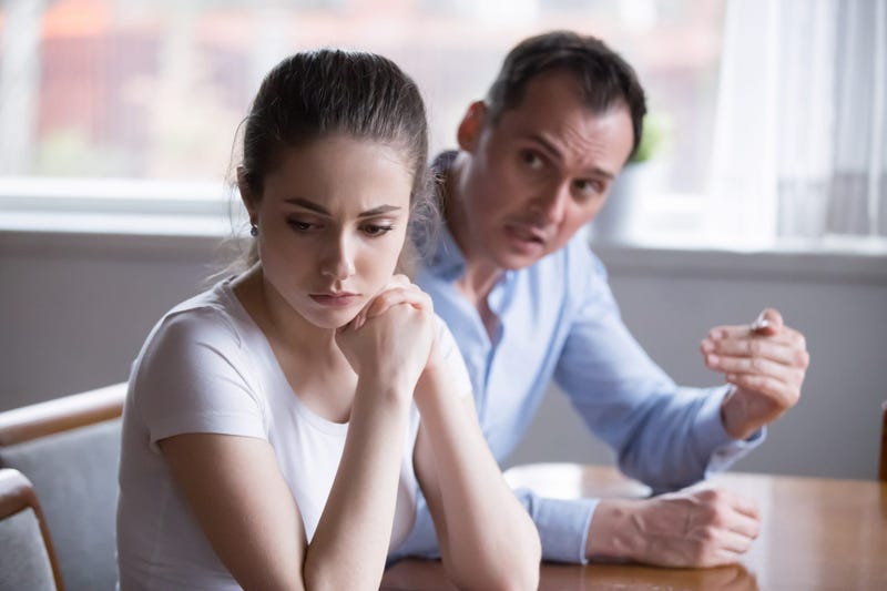 Angry dad, sad woman
