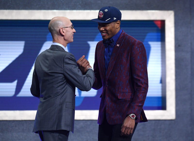 Rui Hachimura poses with NBA Commissioner Adam Silver after being drafted with the ninth overall pick by the Washington Wizards during the 2019 NBA Draft at the Barclays Center