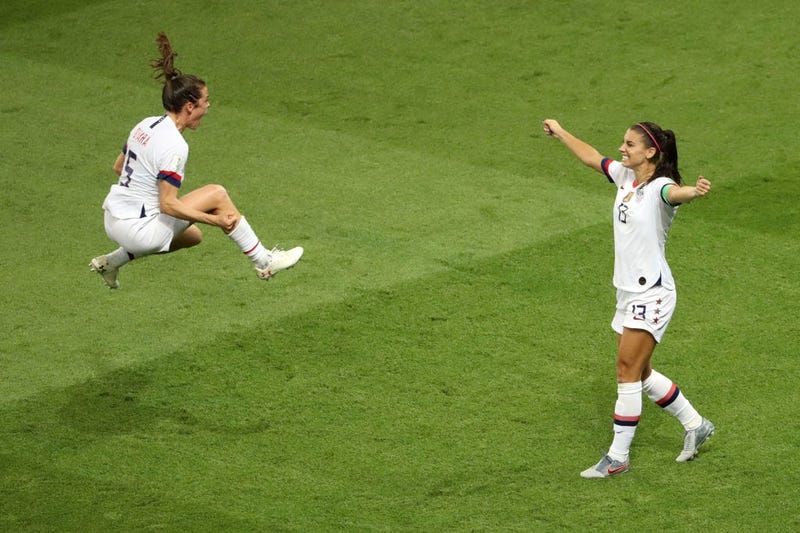 Alex Morgan and Kelley O'hara of the USA celebrate following victory in the 2019 FIFA Women's World Cup France Quarter Final match between France and USA