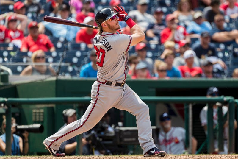 Josh Donaldson #20 of the Atlanta Braves hits the game winning home run against the Washington Nationals during the tenth inning at Nationals Park on July 31, 2019 in Washington, DC.