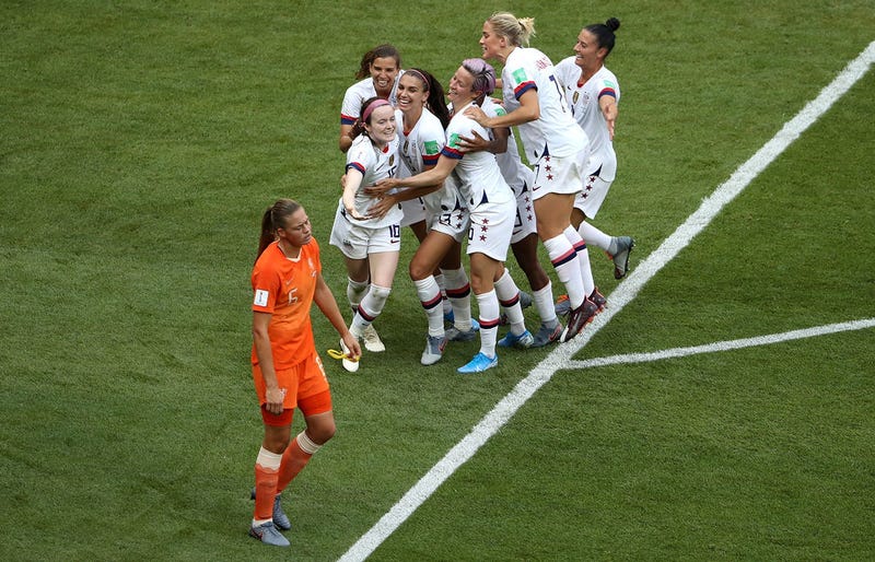 Rose Lavelle of the USA celebrates with teammates after scoring her team's second goal during the 2019 FIFA Women's World Cup France Final match between The United States of America and The Netherlands at Stade de Lyon on July 07, 2019 in Lyon, France