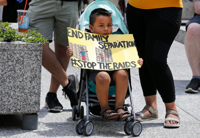 A boy holds a sign during a rally in Daley Plaza on July 13, 2019 in Chicago, Illinois. Protesters attended the rally calling for an end to criminalization, detention and deportations of migrants ahead of planned ICE raids expected to begin tomorrow.
