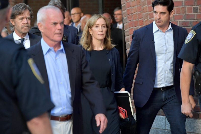Felicity Huffman and husband William Macy exit John Moakley U.S. Courthouse where Huffman received a 14 day sentence for her role in the college admissions scandal on September 13, 2019 in Boston, Massachusetts.