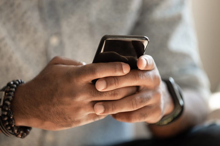 Man reading text messages