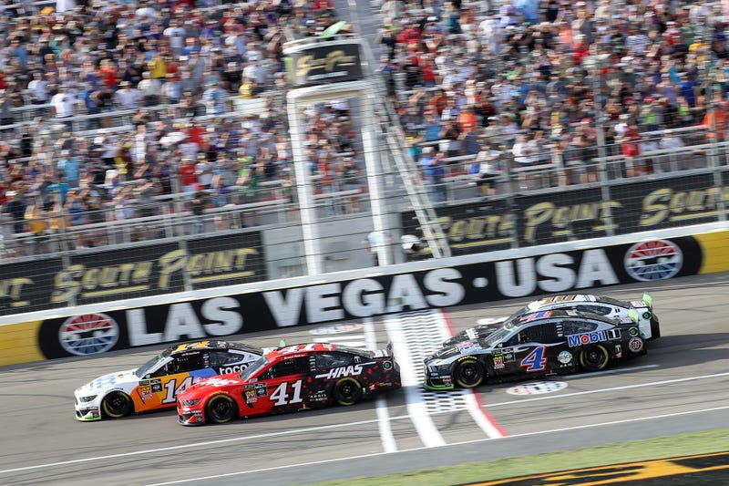 Daniel Suarez, driver of the #41 Haas Automation Ford, and Clint Bowyer, driver of the #14 Toco Warranty Ford, lead the field at the start of the Monster Energy NASCAR Cup Series South Point 400 at Las Vegas Motor Speedway on September 15, 2019