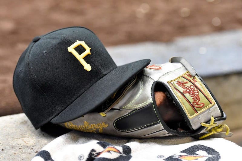 Pittsburgh Pirates baseball cap and a baseball glove