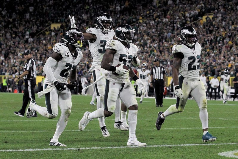 Nigel Bradham #53 of the Philadelphia Eagles celebrates with teammates after making an interception in the fourth quarter against the Green Bay Packers at Lambeau Field.