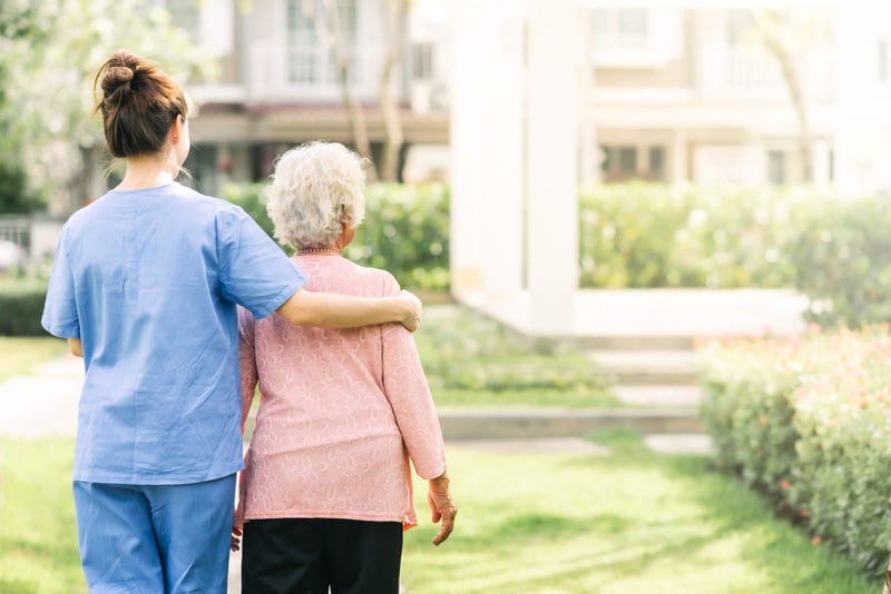 Elderly patient being treated with care at a rehab facility