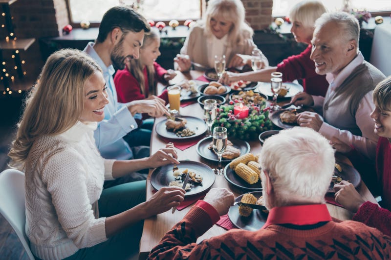 A family eats a meal during the holidays.