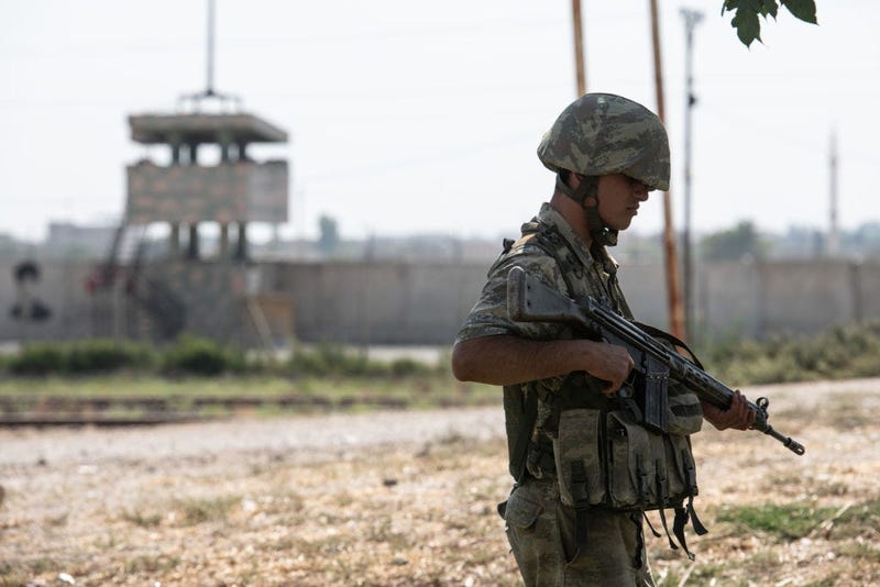 Turkish soldiers stand guard on the Turkish side of the border between Turkey and Syria on October 09, 2019 in Akcakale, Turkey.