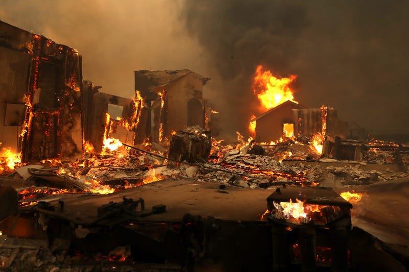 4: A structure continues to burn after the Kincade Fire moved through the area on October 24, 2019 in Geyserville, California.