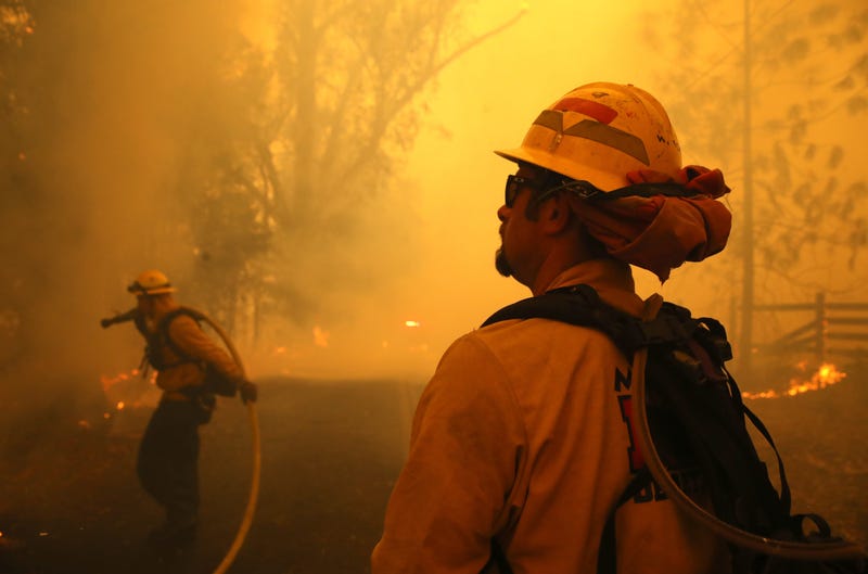 Firefighters battle the Kincade Fire on October 27, 2019 in Windsor. 
