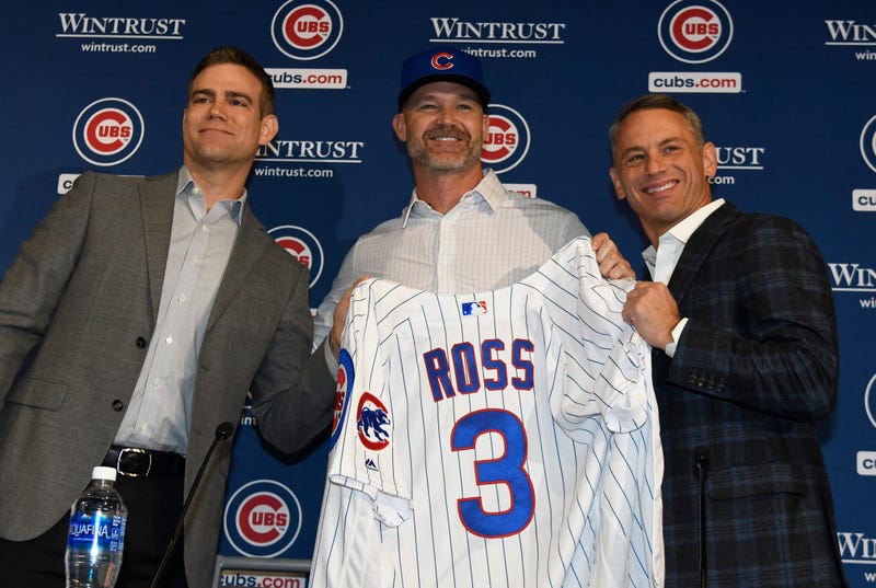 Theo Epstein, president of baseball operations of the Chicago Cubs, (L) David Ross, new manager of the Chicago Cubs (C) and Jed Hoyer, general manager of the Cubs (R) pose for a photo as Ross is introduced to the media at Wrigley Field on October 28, 2019