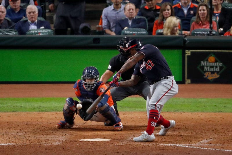 Howie Kendrick #47 of the Washington Nationals hits a two-run home run against the Houston Astros during the seventh inning in Game Seven of the 2019 World Series