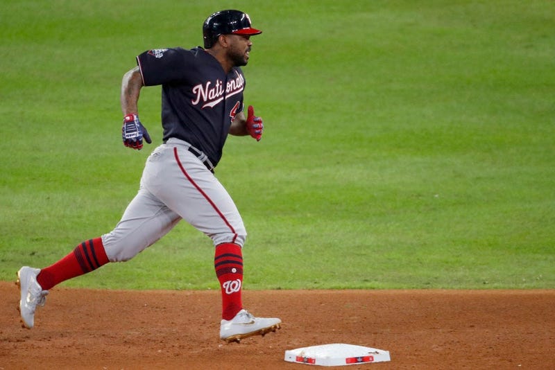 Howie Kendrick #47 of the Washington Nationals hits a two-run home run against the Houston Astros during the seventh inning in Game Seven of the 2019 World Series. 