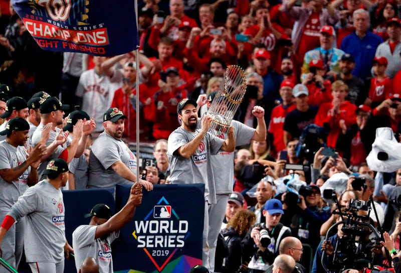 Anthony Rendon hoists the World Series trophy with the Washington Nationals.