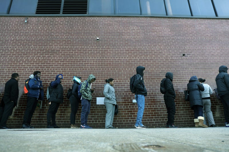 People wait in line for a job fair at a United Parcel Service (UPS) facility on November 01, 2019 in New York City.