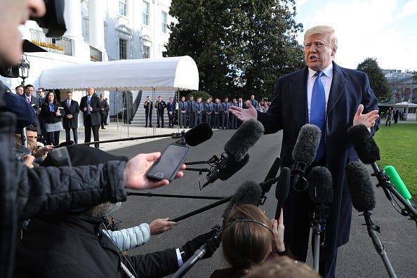 President Donald Trump reporters