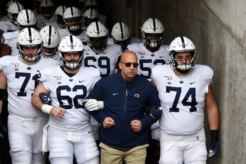 Head coach James Franklin of the Penn State Nittany Lions walks his team onto the field before playing against the Minnesota Golden Gophers.