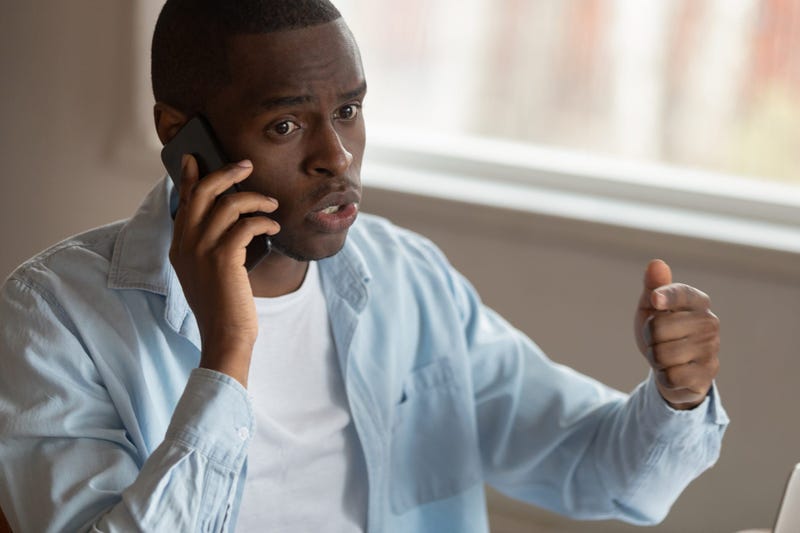 Concerned man talking on the phone