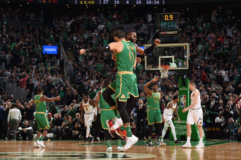Jayson Tatum and Jaylen Brown celebrate against the Denver Nuggets