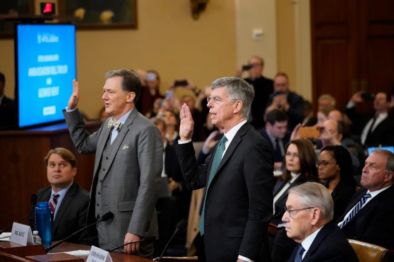  Top U.S. diplomat to Ukraine, William B. Taylor (R), and Deputy Assistant Secretary for European and Eurasian Affairs George P. Kent (L) are sworn in prior to providing testimony to the House Intelligence Committee on Nov. 13, 2019. 