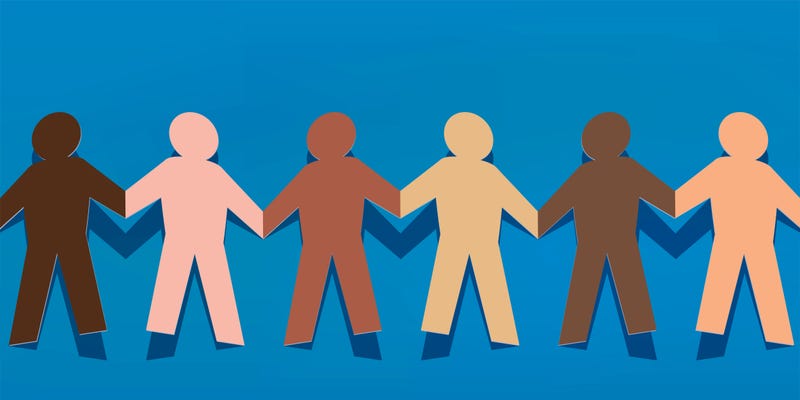 Symbol of solidarity between peoples with paper characters of different colors that hold hands