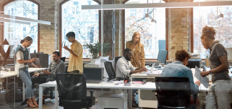 Group of young mixed race business people working together in the creative office.