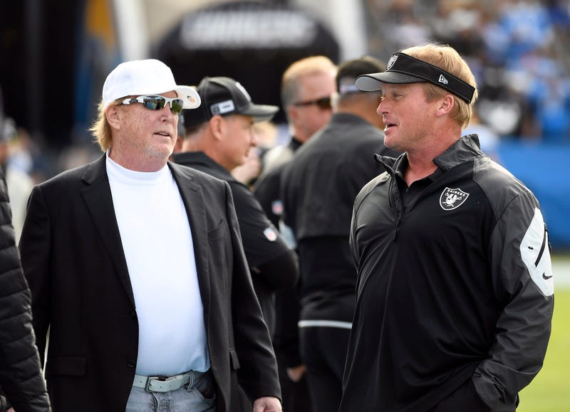 Oakland Raiders owner Mark Davis greets head coach Jon Gruden of the Oakland Raiders before the start of the game against Los Angeles Chargers at Dignity Health Sports Park on December 22, 2019