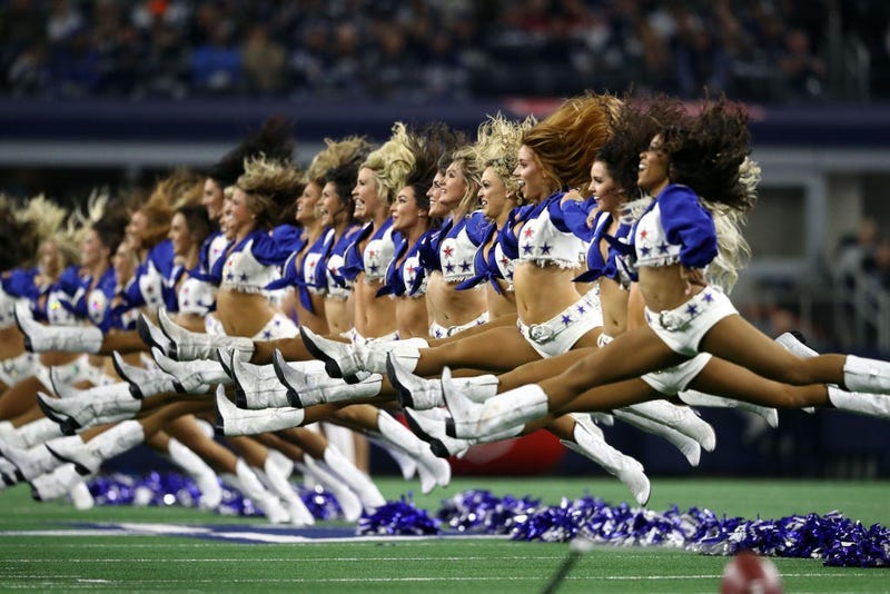 ARLINGTON, TEXAS - NOVEMBER 28: The Dallas Cowboys Cheerleaders jump while performing at AT&T Stadium on November 28, 2019 in Arlington, Texas. (Photo by Ronald Martinez/Getty Images)