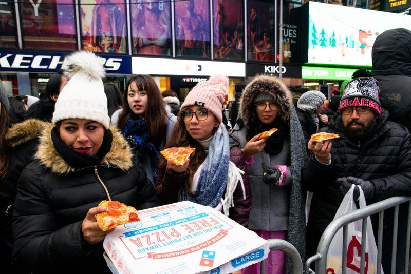 People eating Pizza in Times Square