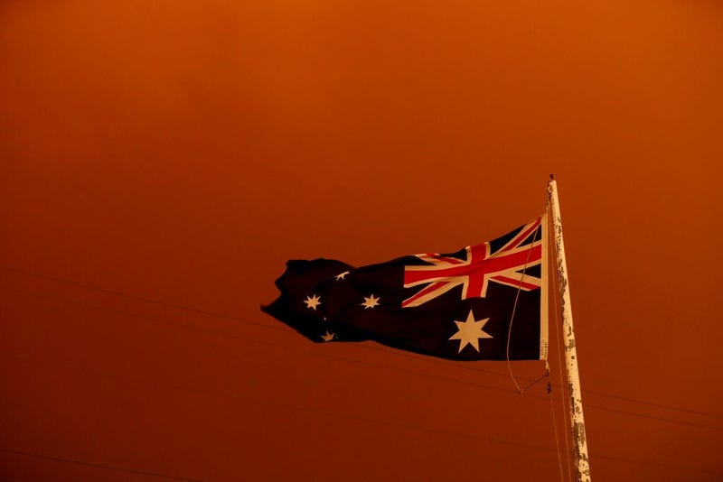 The Australia Flag flies under red skies from the fires on January 04, 2020 in Bruthen Australia. 