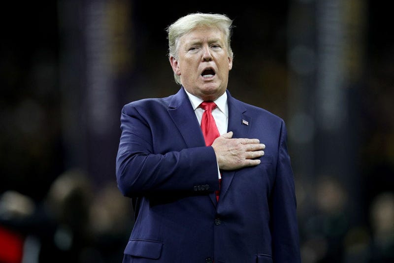U.S. President Donald Trump stands for the national anthem prior to the College Football Playoff National Championship game between the Clemson Tigers and the LSU Tigers at Mercedes Benz Superdome on January 13, 2020 in New Orleans, Louisiana. (