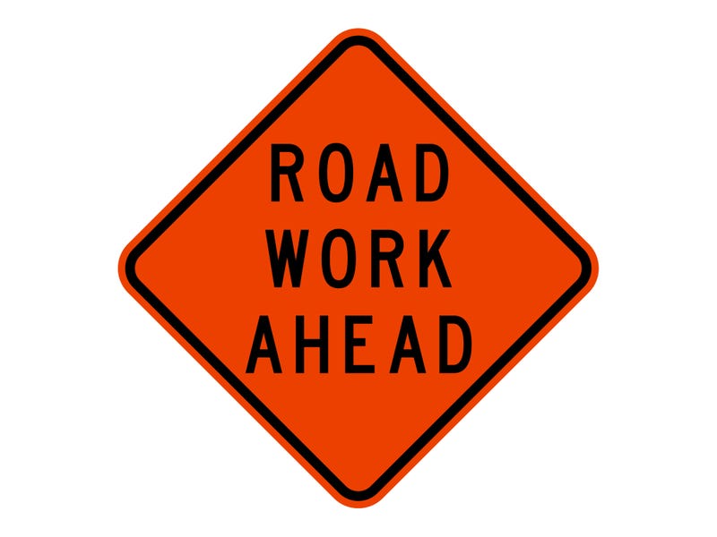 isolated road sign for road work