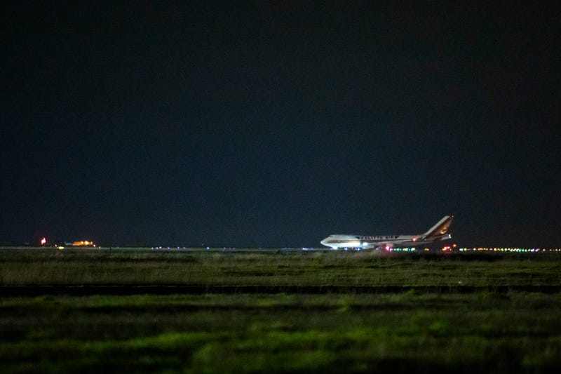 A cargo aircraft chartered by the U.S. government arrives from Japan carrying American citizens being evacuated from the quarantined Diamond Princess cruise ship, at Travis Air Force Base on February 16, 2020.