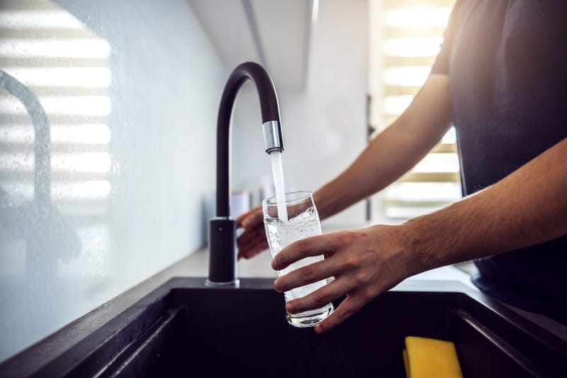 Person getting a glass of water