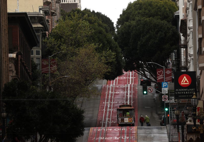 couple approaches an empty Cable Car on March 16, 2020 in San Francisco.
