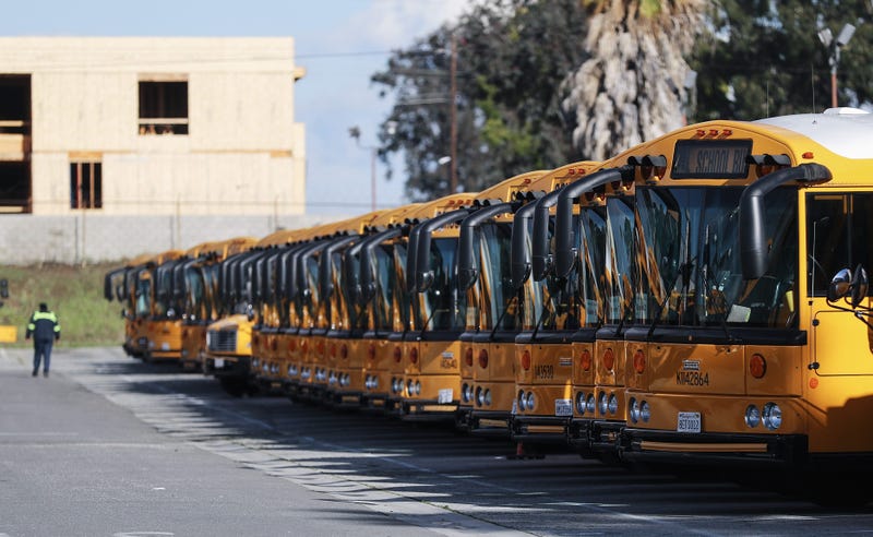 chool buses are parked in a lot, idled by the closing of schools in response to the novel coronavirus outbreak, on March 17, 2020 in Gardena, California.