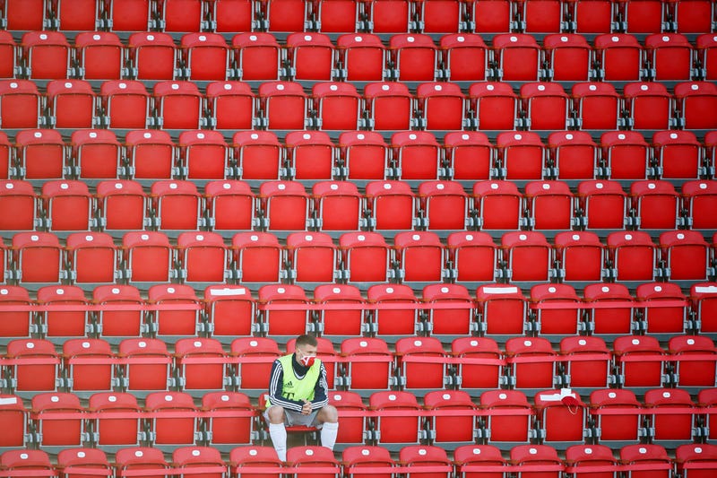 BERLIN, GERMANY - MAY 17: Bayern Munich susbstitute Lukas Mai in the stands wearing a protective face mask during the Bundesliga match between 1. FC Union Berlin and FC Bayern Muenchen at Stadion An der Alten Foersterei on May 17, 2020 in Berlin, Germany.