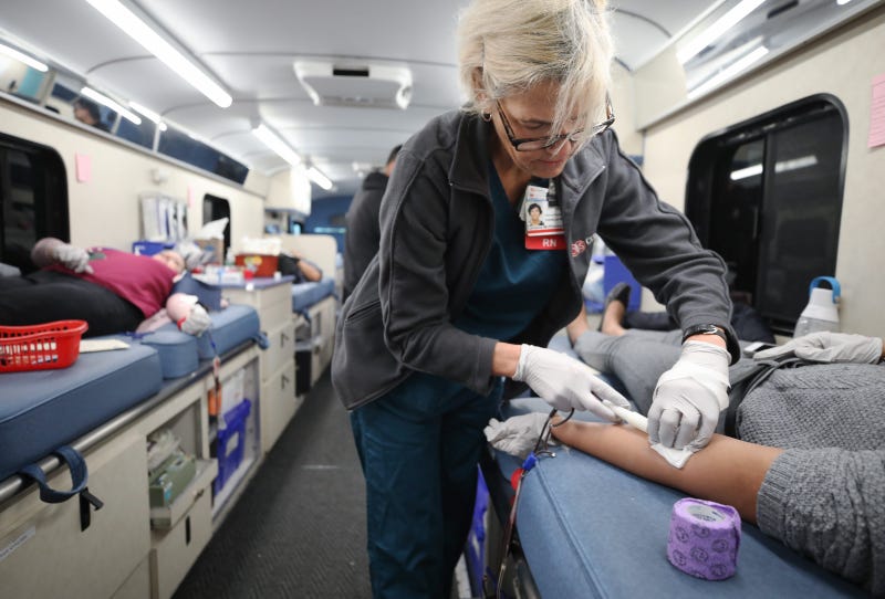  Cedars-Sinai charge nurse Lorraine McPherson works as employees donate blood during a blood drive held in a blood mobile outside Cedars-Sinai Medical Center on March 19, 2020 in Los Angeles