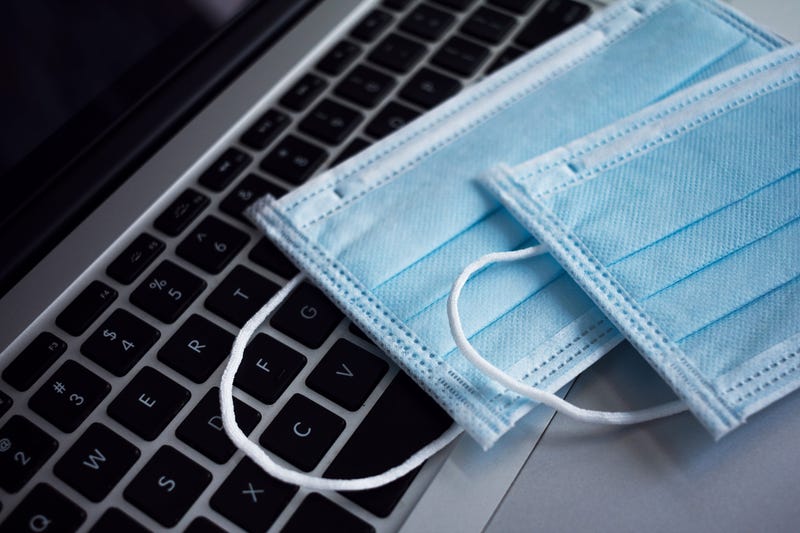 Two surgical masks on a computer