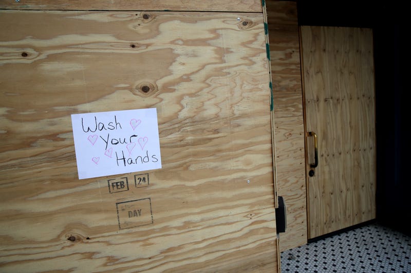SAN FRANCISCO, CALIFORNIA - MARCH 20: A sign urging people to wash their hands is posted on plywood that is covering the windows of a business on Valencia Street on March 20, 2020 in San Francisco, California.