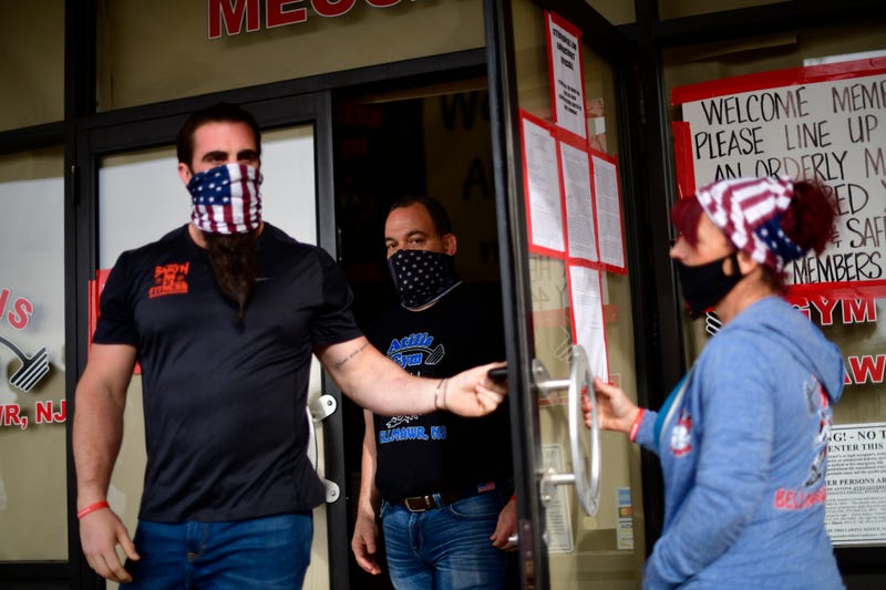 mployees exit to greet patrons lining up outside the Atilis Gym on May 20, 2020 in Bellmawr, New Jersey.