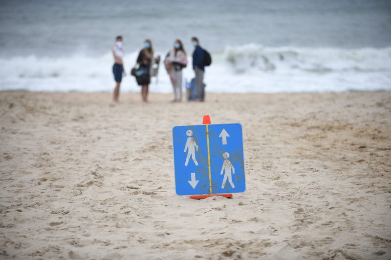 Signs are placed on the beach to direct people on how to keep social distance during Memorial Day weekend on May 24, 2020 in Montauk, New York.